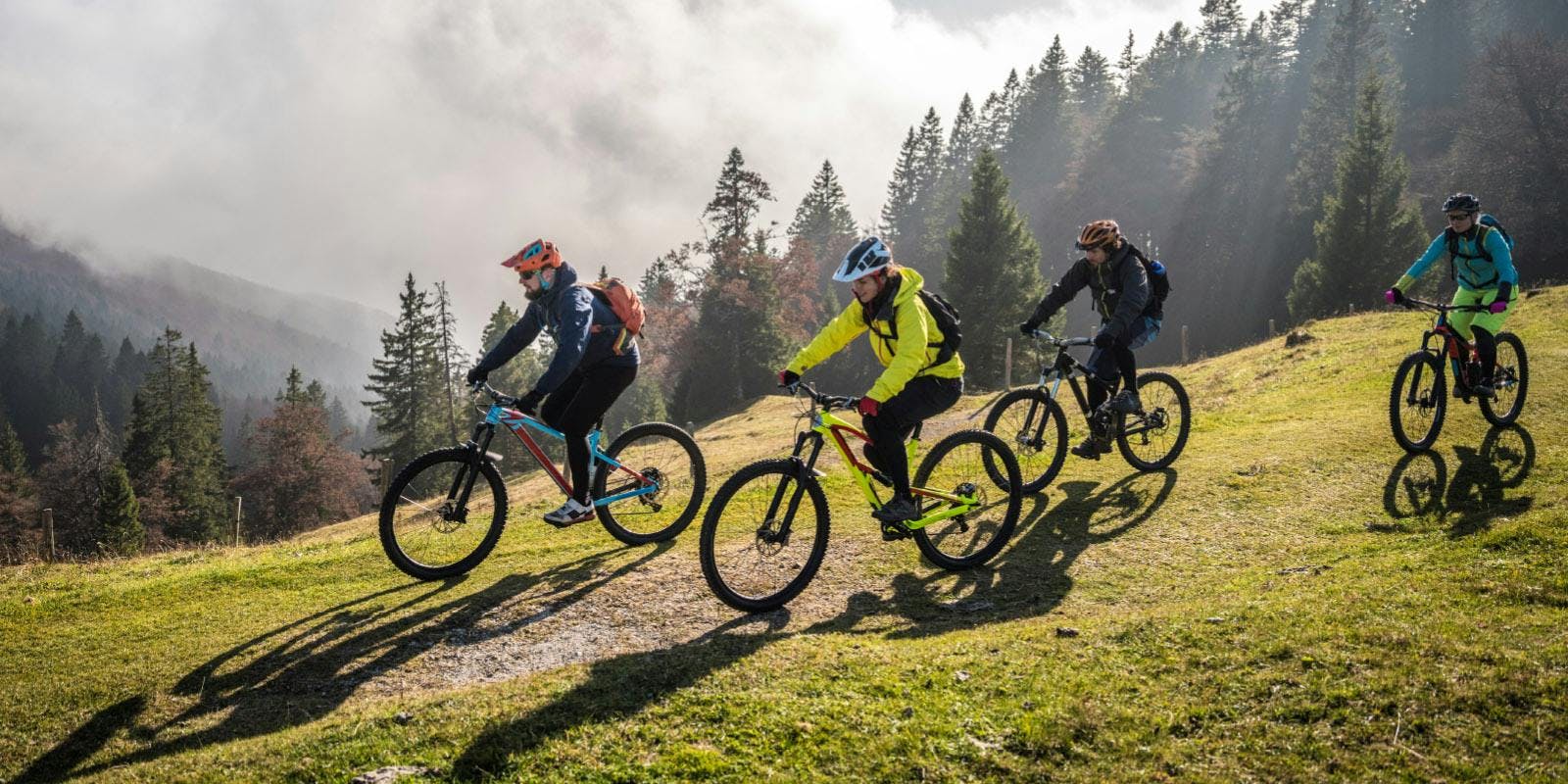 Mountain bikers in the foggy highlands